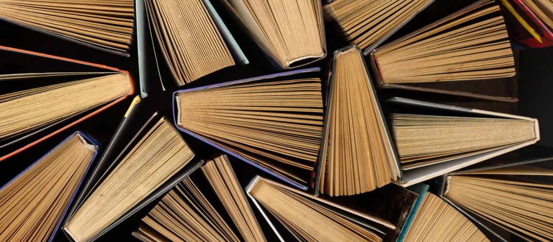 Old used books. Hardback books. Close up.